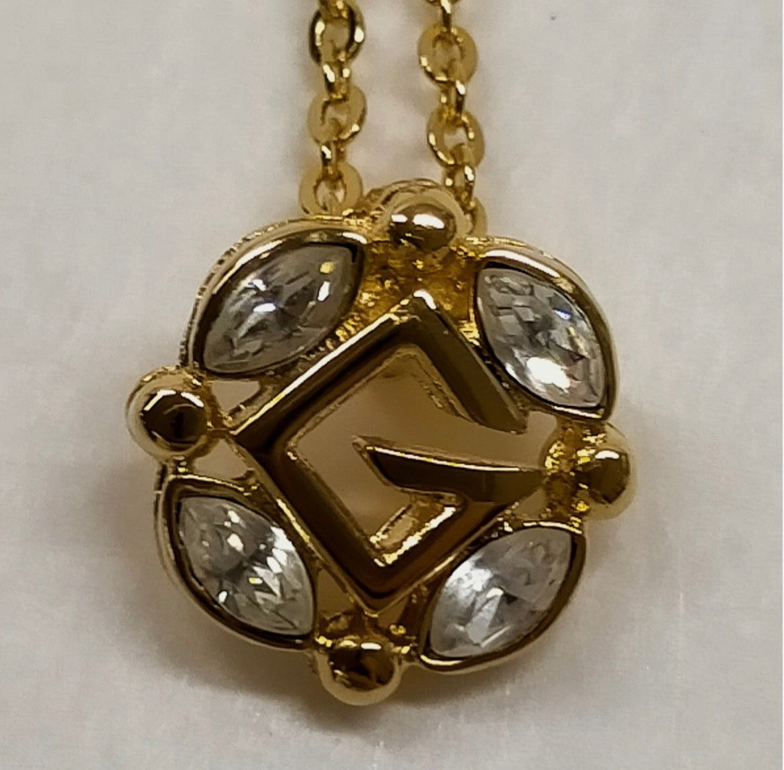 Givenchy Gold Tone Crystal G Pendant Necklace